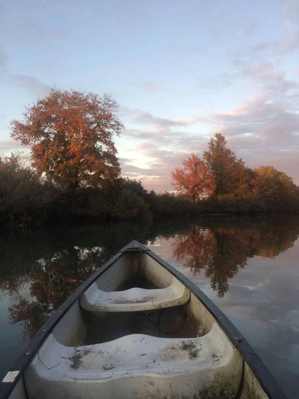 Il fiume Ausa al tramonto dalla canoa